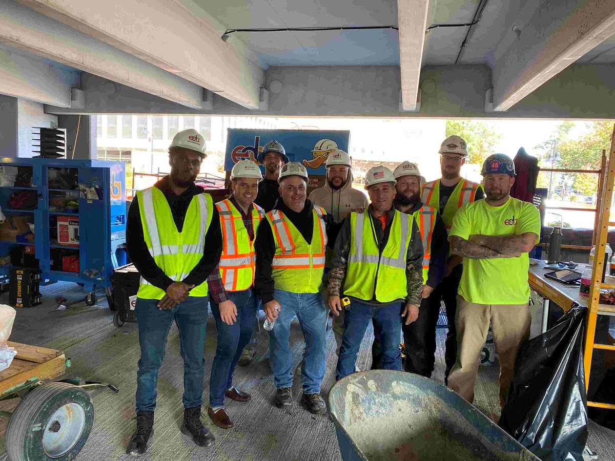 Group of construction workers in parking garage